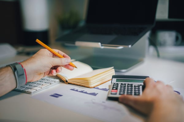 Calculator and notes on a desk